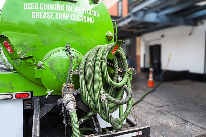 a plumber pumping a grease trap in Anaheim, CA